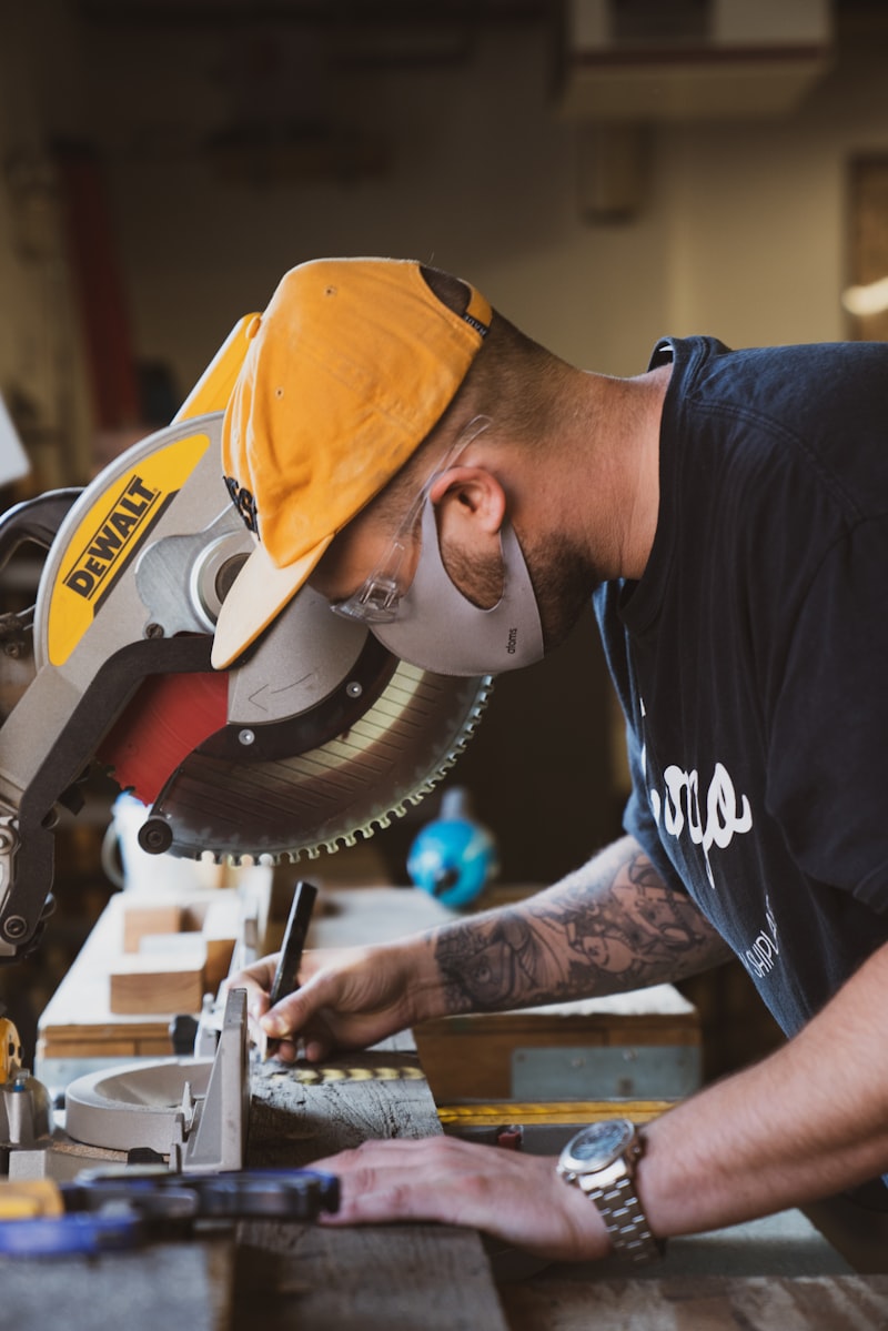 Craftsman shaping wood in the FL Interiors shop