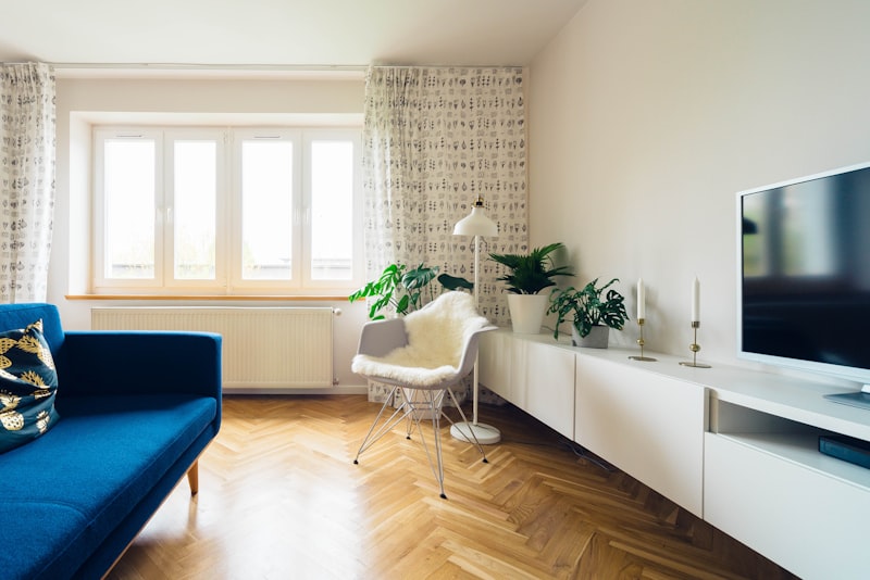 Bright apartment interior with open wood shelving